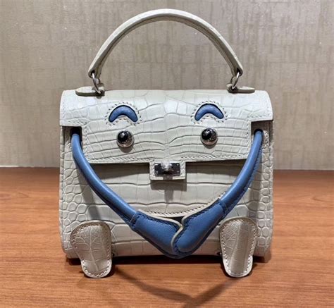 Hermes Kelly Doll Bag in Pearl Grey Matte Alligator Leather.